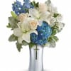 As hopeful as a bright blue sky, this beautiful arrangement of lush