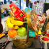A small fruit and gourmet basket with fruit and gourmet stuff. A