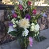 Mixed bouquet with assorted white and purple blooms. 