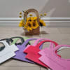 Nestled in charming kraft tote that reads love is love, this floral