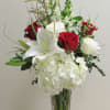 A romantic arrangement in classic red and white. The perfect gift for