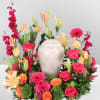 Consoling Embrace is a stunning memorial arrangement brimming with hot pink roses