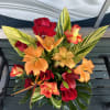 Colorful and tall exotic arrangement in a vase. 