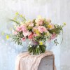 A fan shape hand tie bouquet create with soft pink, pastel color