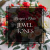 Make a statement with our Jewel Tones Designer&rsquo;s Choice arrangement. Handcrafted by