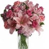 A combination of pink flowers like roses, hydrangeas, wax, alstroemerias, carnations and