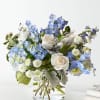  soft light blue and white flowers that created a lovely centerpiece
