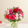 All-around arrangement with red roses, hot pink roses &amp; carnations, pink Peruvian