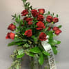 18 red roses in a cylinder vase 