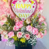 12 pink roses, greenery, baby breath and pink carnations. Tones of PINK