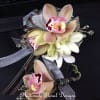 This elegant orchid boutonniere and corsage set features blush cymbidium orchids with