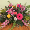 Express your sympathy with a beautiful garden inspired casket spray. Available in