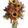 sunny sunflowers , alstromeria , roses and fall foliage in a glass