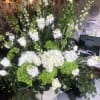 Classic and Beautiful, this brilliant arrangement whispers luxury.  White , greens