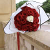 30 red roses and 1 white rose in the middle, wrapped in