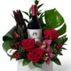A beautiful arrangement with Red Roses, Pink Orchids, Hot Pink and Red