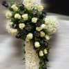 This elegant funeral cross is a heartfelt tribute, symbolizing faith, hope, and