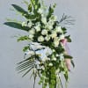A lovely asymmetrical White Standing Spray with Orchids and Mixed Flowers