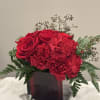 A stunning bouquet featuring the timeless elegance of vibrant red roses paired