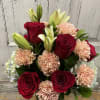 A Beautiful mixture of red roses, blush and pink carnations! popping out