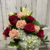 A Beautiful mixture of red roses, blush and pink carnations! popping out