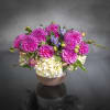 This 2 tone ceramic vase is packed with Sylvia Dahlias accented with
