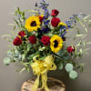 Brighten her morning with sunflowers and red roses. 