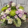 Welcome to a magical forest of greens that light up this arrangement!