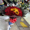 50 red  roses with three sunflower in the middle bouquet