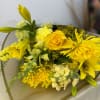  hand-tied bouquet featuring various yellow flowers, likely symbolizing friendship, joy, and