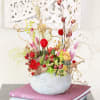 Our bestselling Assorted Succulent arranged in 7&quot; Smile face ceramic seafoam color