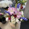 Mix flowers, including roses, lilies, daisies, and a lot more large vase