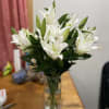 A large Lilly arrangement in a vase