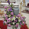 Lavender stock/gladiolas, cremone/spider mums, roses, purple stock/gladiolas, white daisies,  stargazer lilies