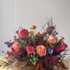 Flowers: free spirit roses, burgundy amaranthus, royal blue delphinium, orange spray roses