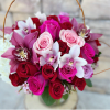 This beautiful design includes White hydrangea, cymbidium orchids, and roses, in a