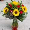 Nothing says summer like a beautiful mix of red roses and sunflowers.