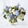 The Serenity Blue Bouquet is a breathtaking arrangement of soft white roses