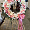 A delicate and loving tribute, this crown expresses peace, tenderness, and respect