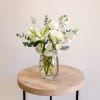 This graceful design features all white blooms such as roses, roselilies, fragrant