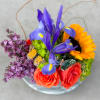 Mama vase full of lilacs, roses, sunflowers and hydrangeas accented with curly