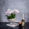 Imagine an ethereal oasis captured in a glass pedestal vase named &quot;Enchanted