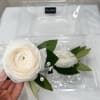 This elegant white ranunculus corsage and boutonni&egrave;re are the perfect choice to
