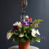 This sympathy arrangement is filled with florals of love in a terracotta