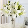 Might release or all white arrangement in a keepsake sympathy container
, loving