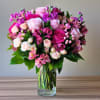 An enchanting cascade of soft pinks, this bouquet is a true celebration
