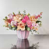 A soft mix of   front facing roses, pink lisianthus 