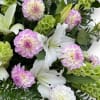 A Funeral Basket consisting of Dahlias, Lilies, and Roses. This design is