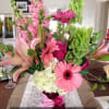 Make their day bright with this eye catching bouquet!
This arrangement features: Gerbera