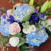 This lovely mixture of blue Hydrangea, powder pink and white  Roses